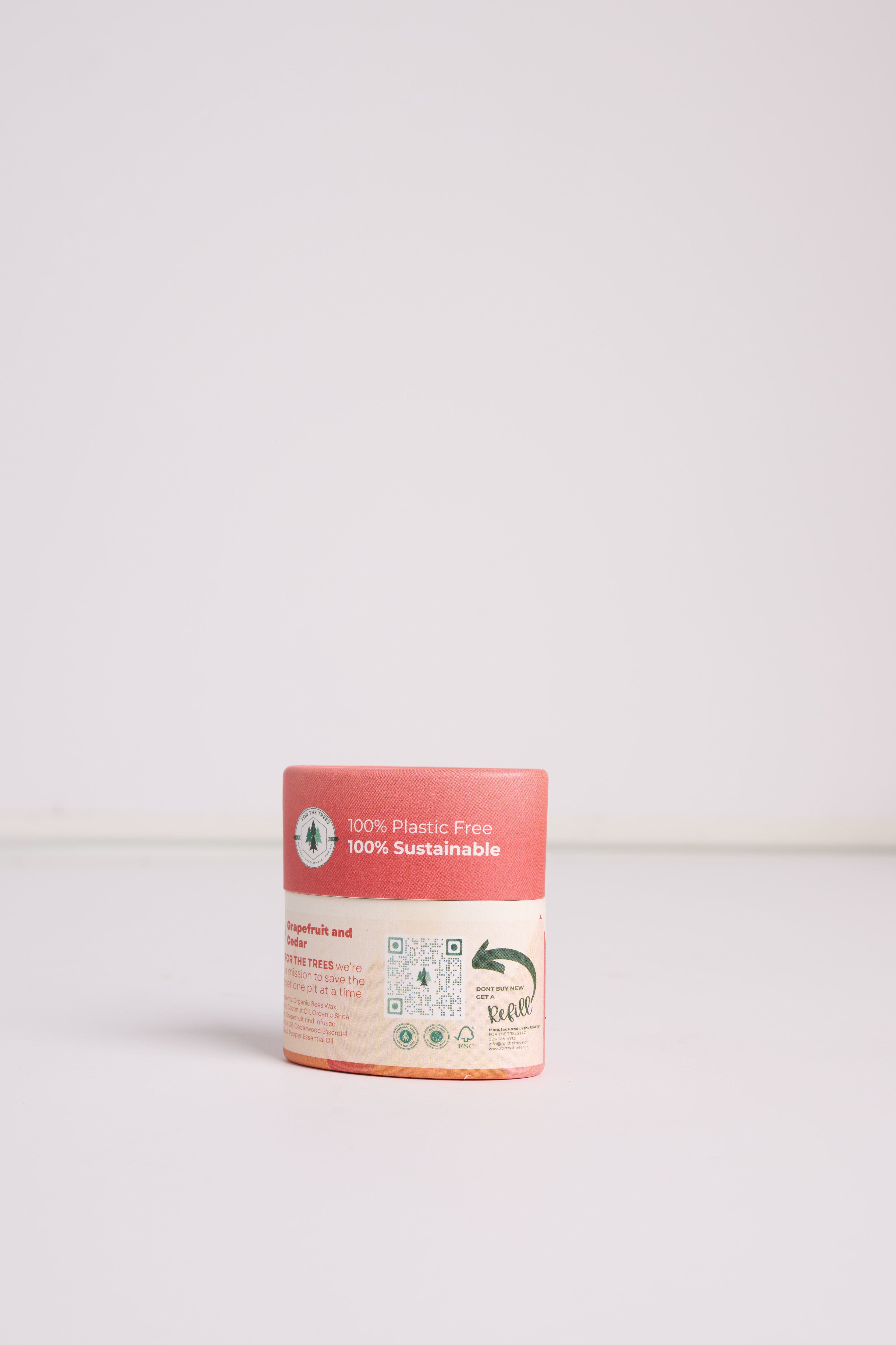 A Travel Size Grapefruit and Cedar All Natural Deodorant (rear label facing)