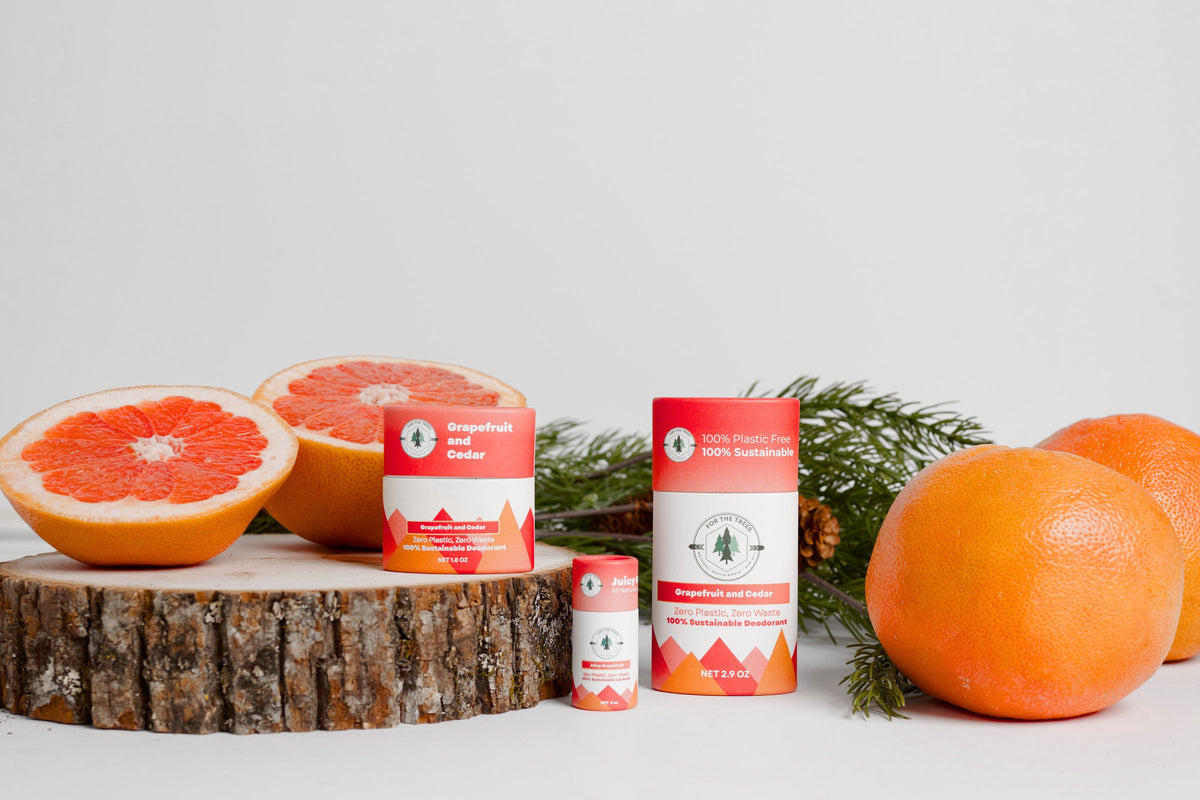 Grapefruit and Cedar deodorant line with fresh grapefruit